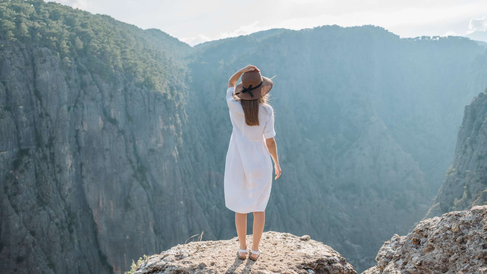 Mental Summit Woman Top of Mountain White Dress